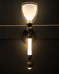 Glass Glow torch-style wall light with frosted glass cup, glowing bubble glass rod and dark metal body by Diamond Electrical Industries, Kolkata